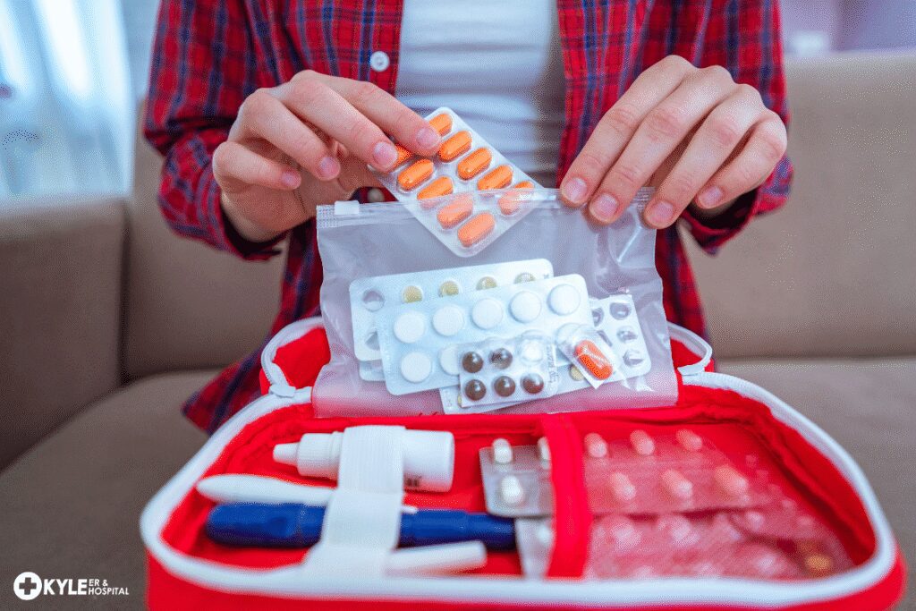 Person organizing various medications and pills from blister packs.