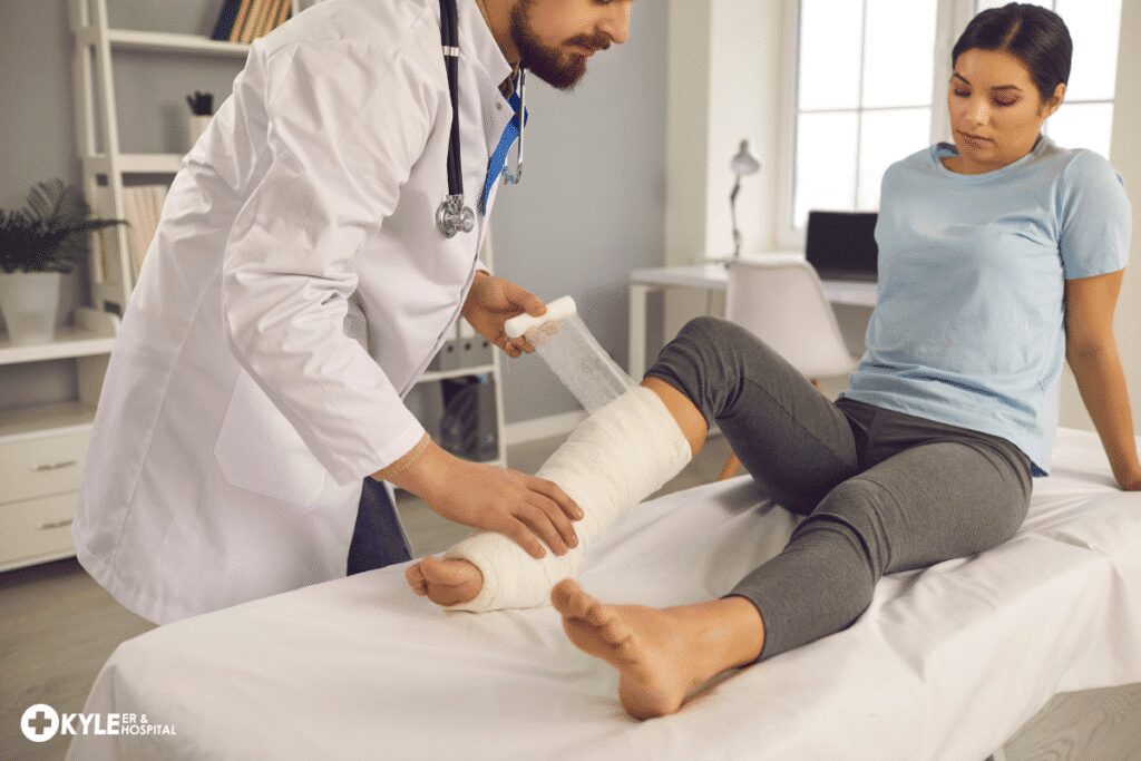 Doctor examining a patient's bandaged leg in a clinic.
